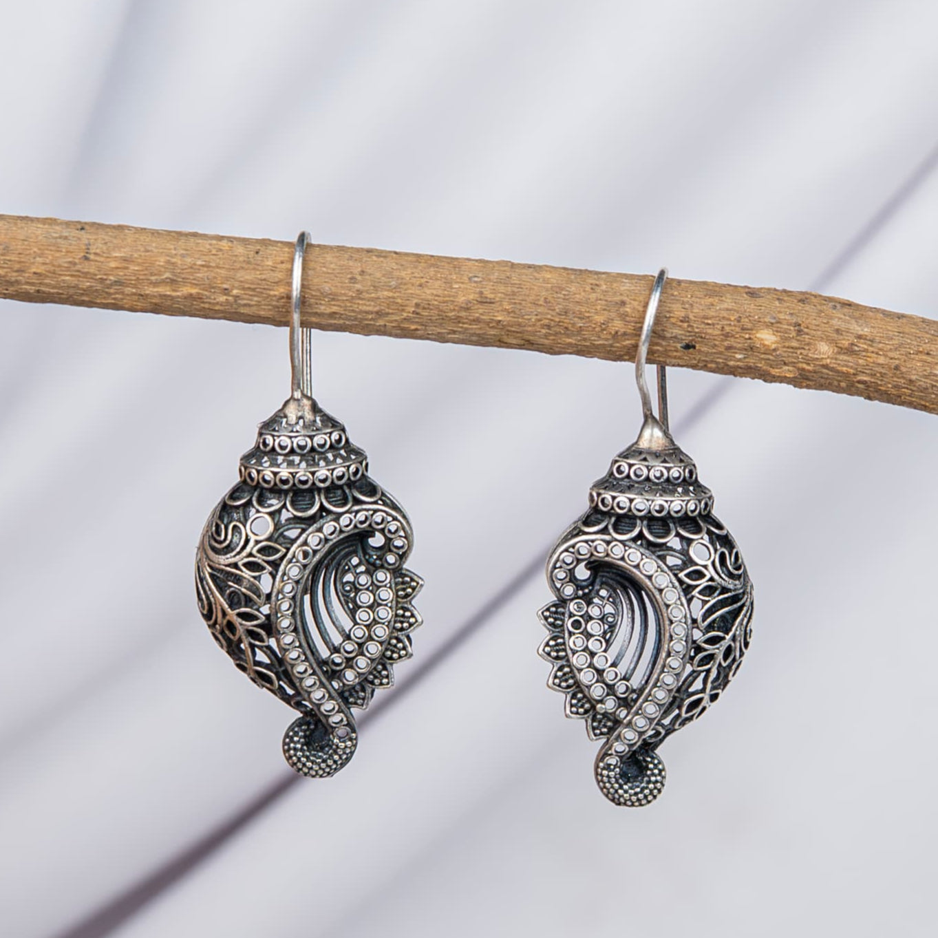 Silver Look Alike Shell-Shaped Earring with Intricate Filigree Work