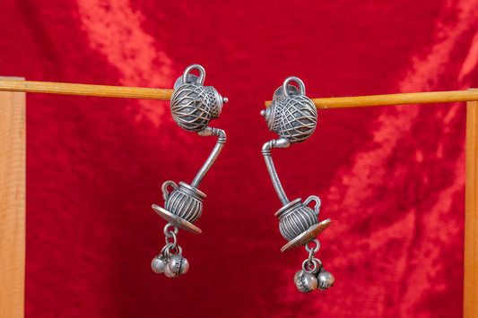 Silver Look-Alike Kettle Pouring Tea with Dangling Beads