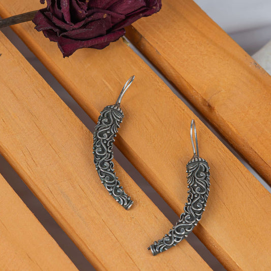 Silver Look-Alike Mirchi Earring with Intricate Floral Engraving