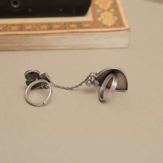 Silver Look-ALike Dual-Finger Ring with Dangling Chain and Ornate Charm