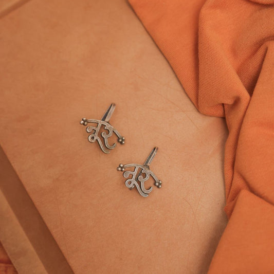 Silver Look-Alike Earring Featuring Artistic 'Noor' Motif
