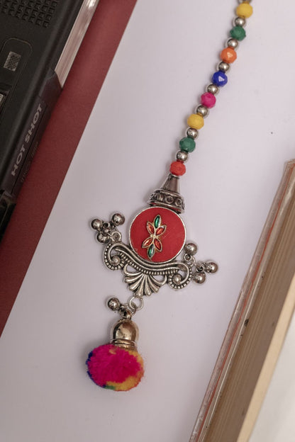 Multicolor Beaded Oxodise Tika with Red Floral Center & Pom Pom
