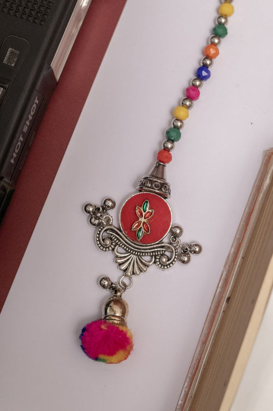 Multicolor Beaded Oxodise Tika with Red Floral Center & Pom Pom